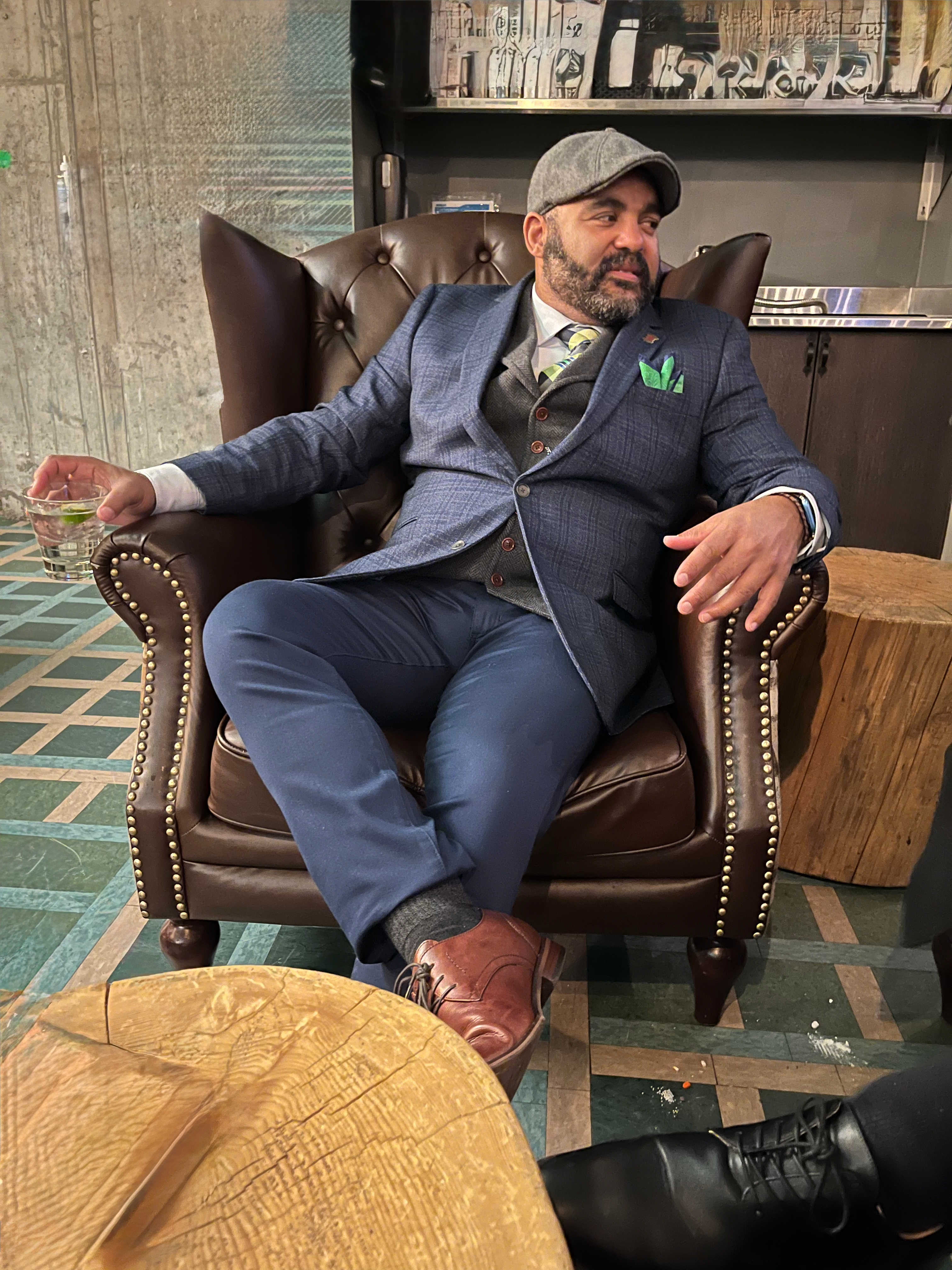 George D. Brown portrait — blue suit in leather chair